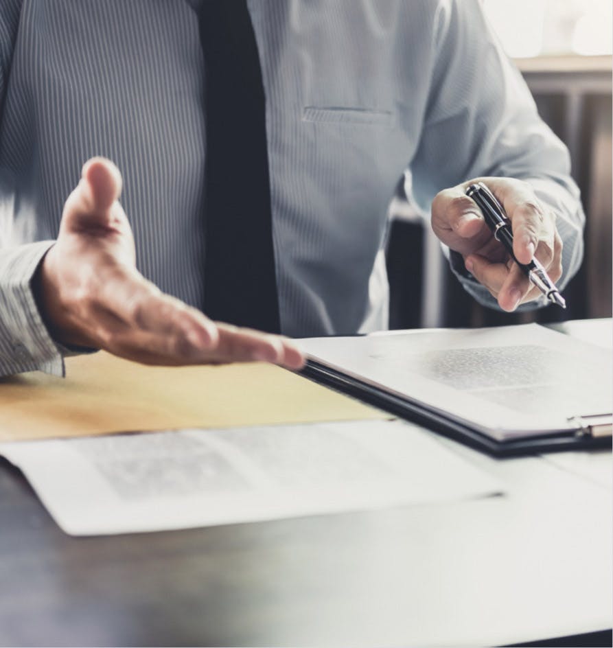 Lawyer explaining something while looking over papers