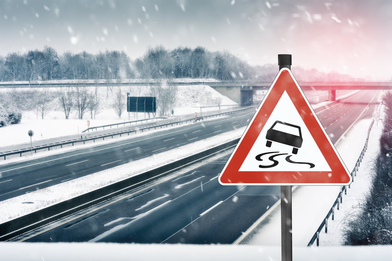 Icy road with dangrous weather conditions