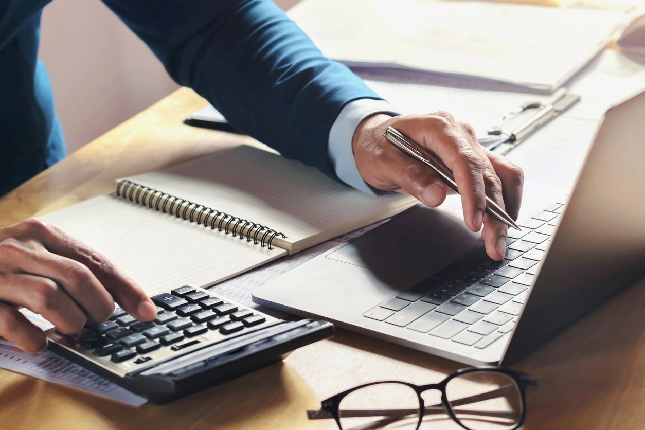 Man calculating figures