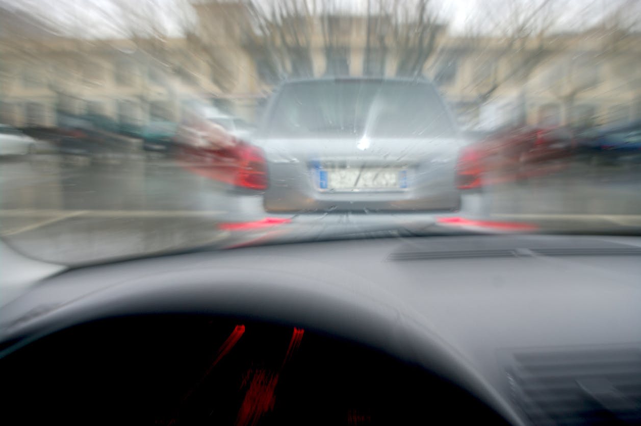 Car following another vehicle very close.