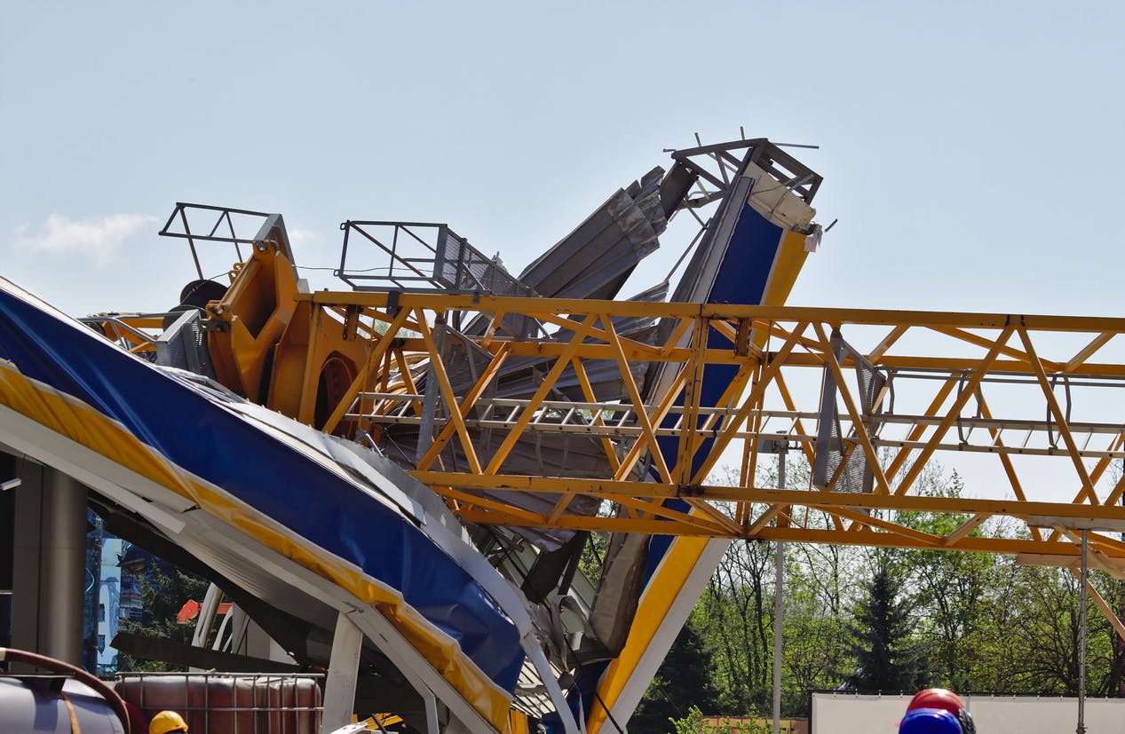 Crane that has fallen into a building.