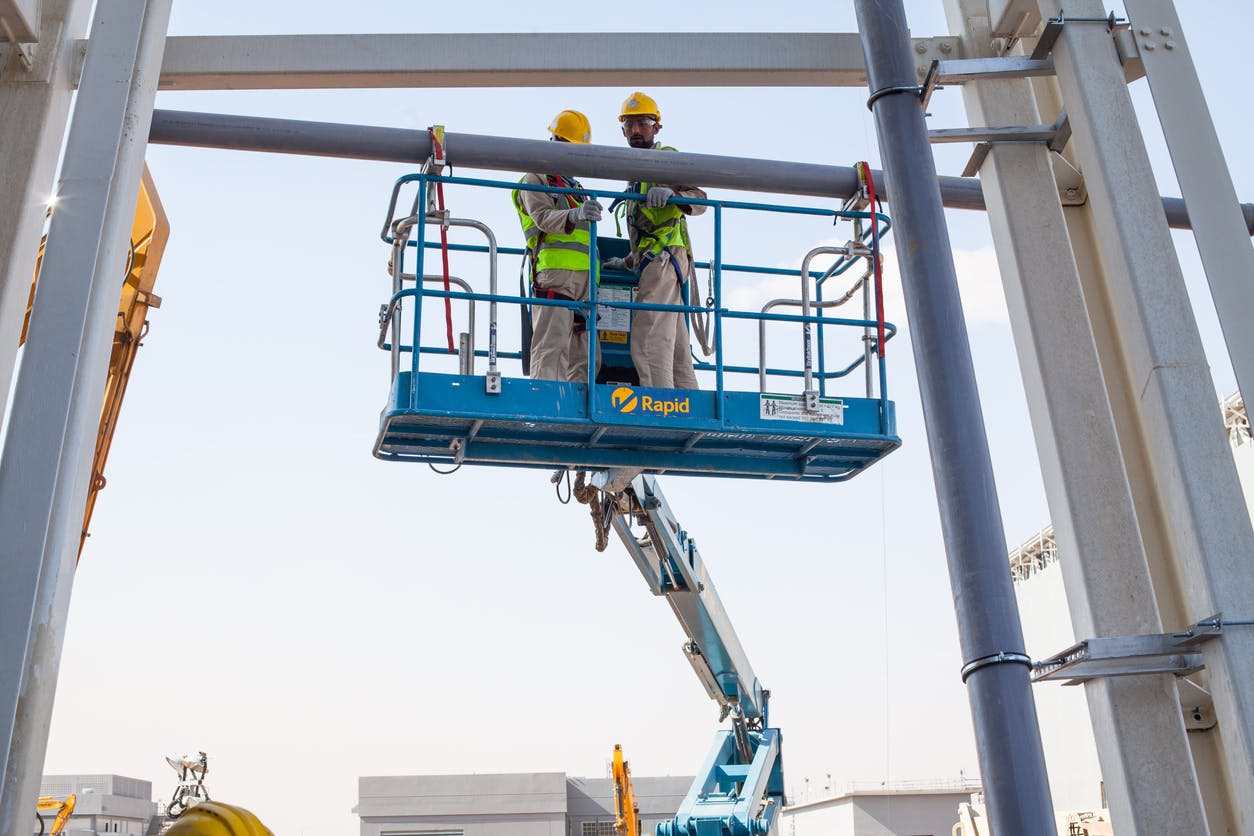 Construction workers on boom lift