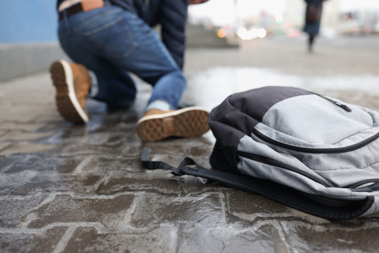 Man slips and falls on city street