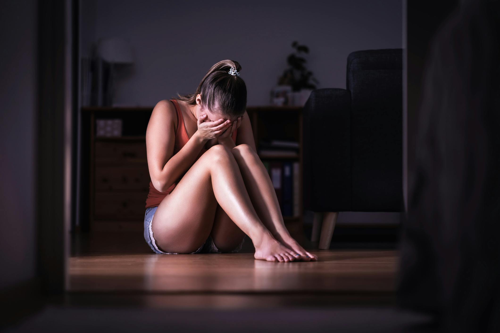 Woman crying on floor