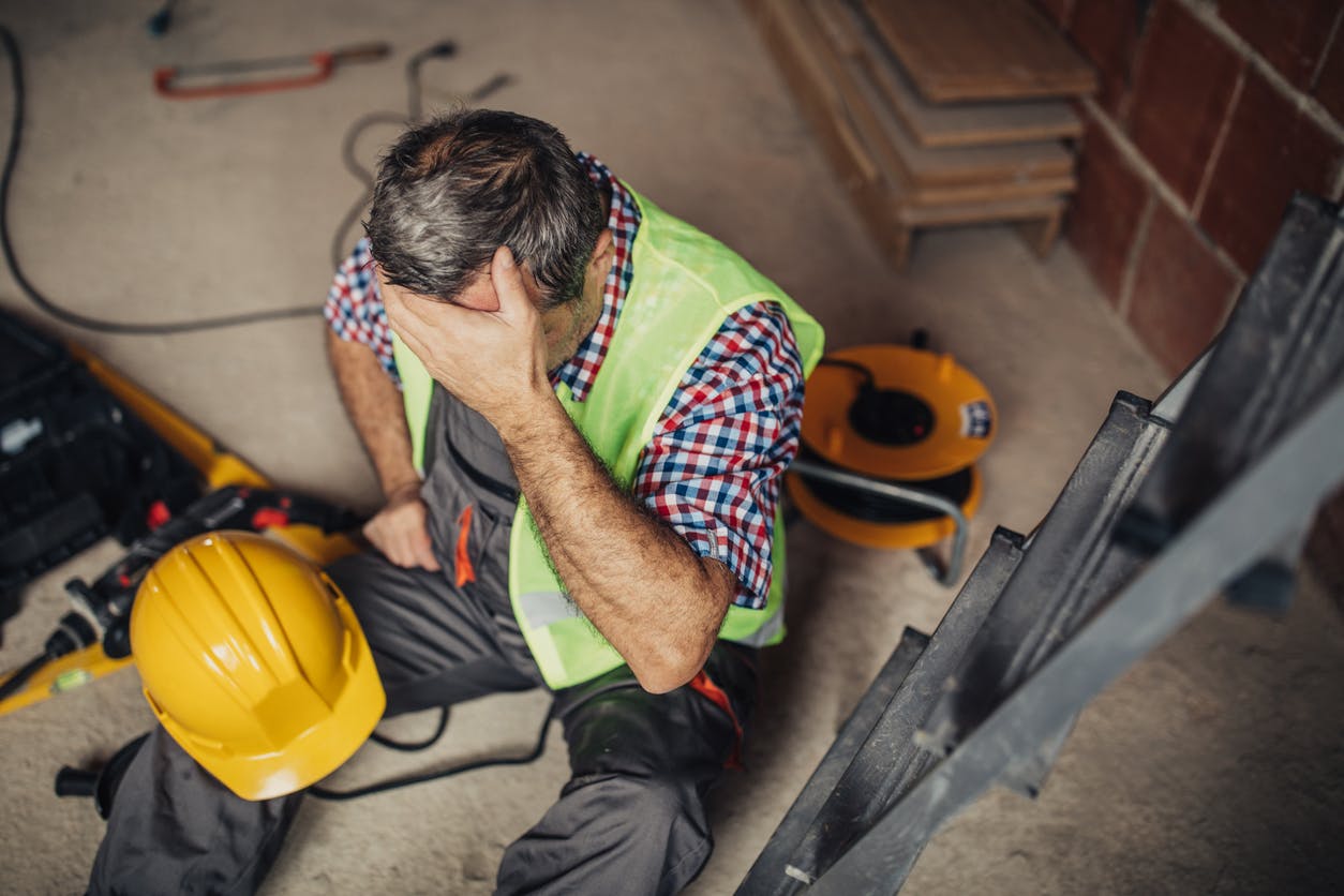 Injured construction worker in pain