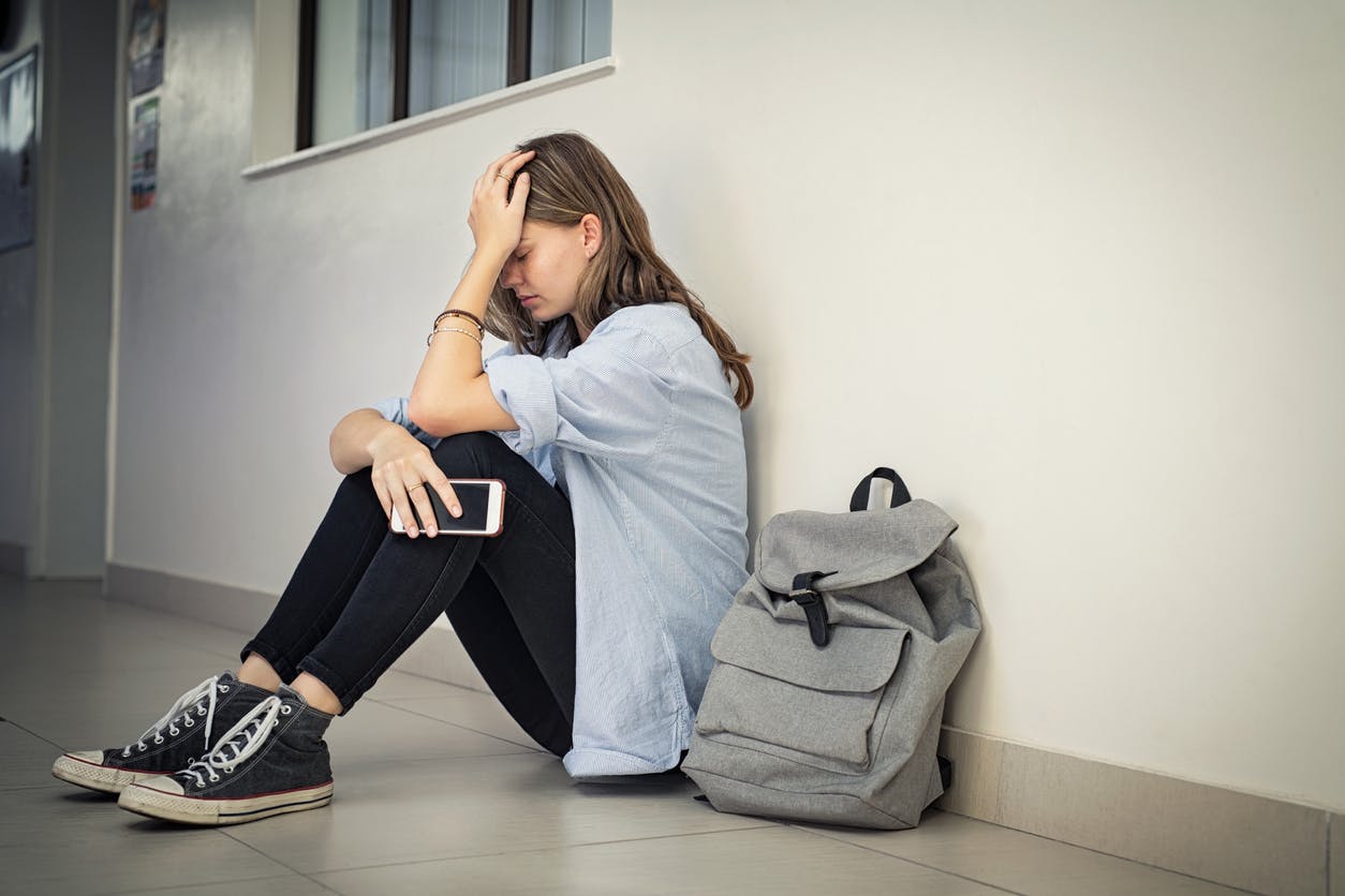 Sad looking girl at school.