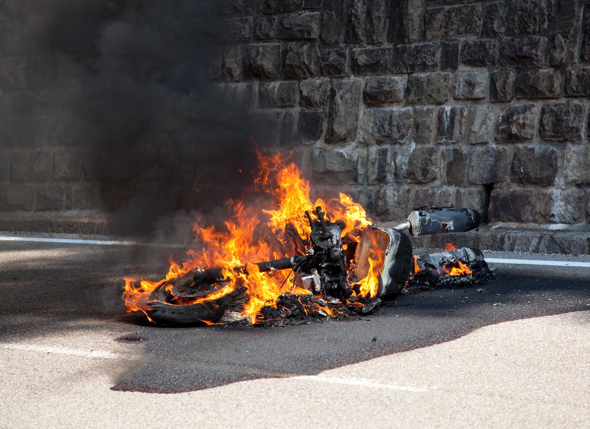 Motercycle burning after accident