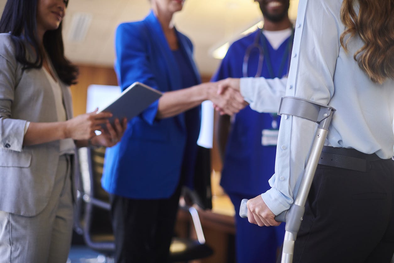 Injured worker talking with lawyers