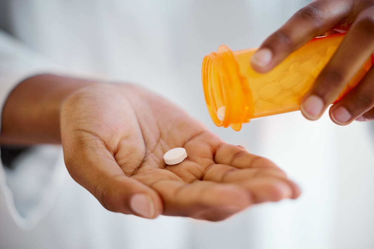 Woman taking prescription medication