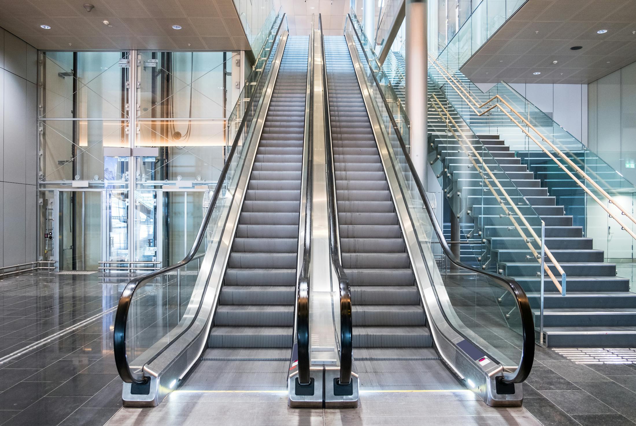 brand new escalator next to stairs