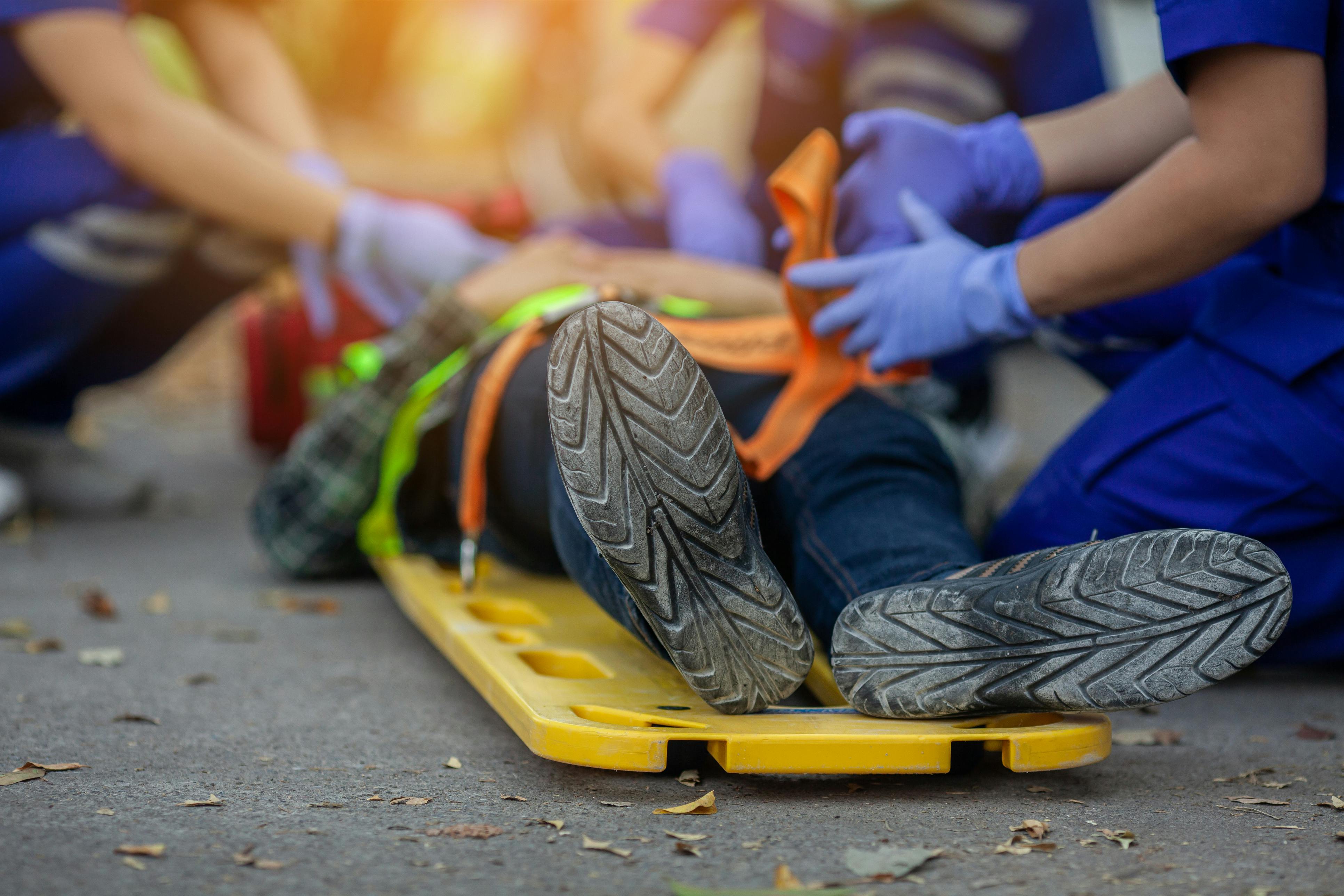 Construction worker on a medical stretcher after construction accident