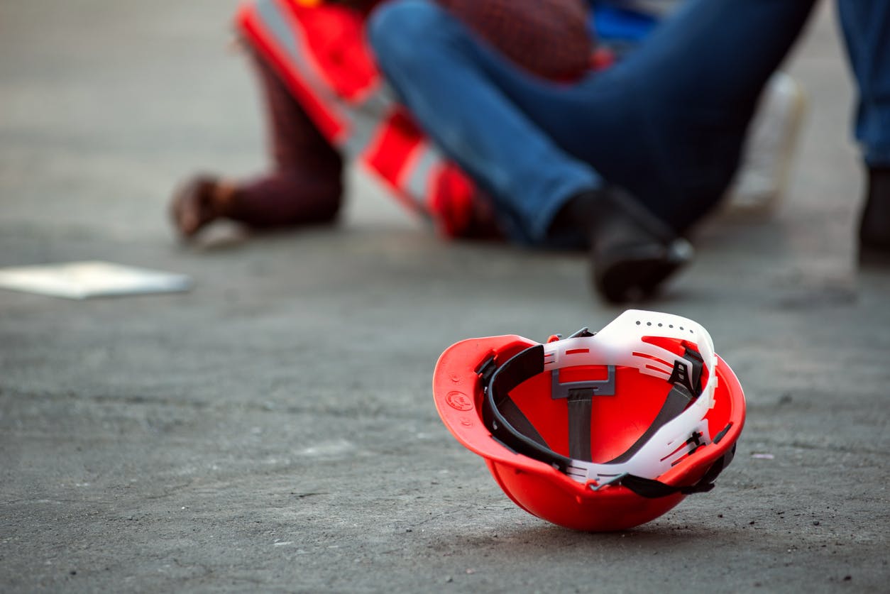 African american male fallen on the ground on construction site