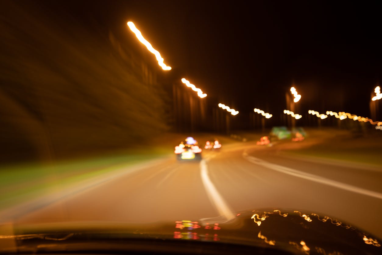Person driving down a road while impaired