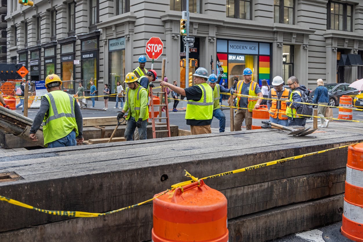 City crews working on a busy NYC street