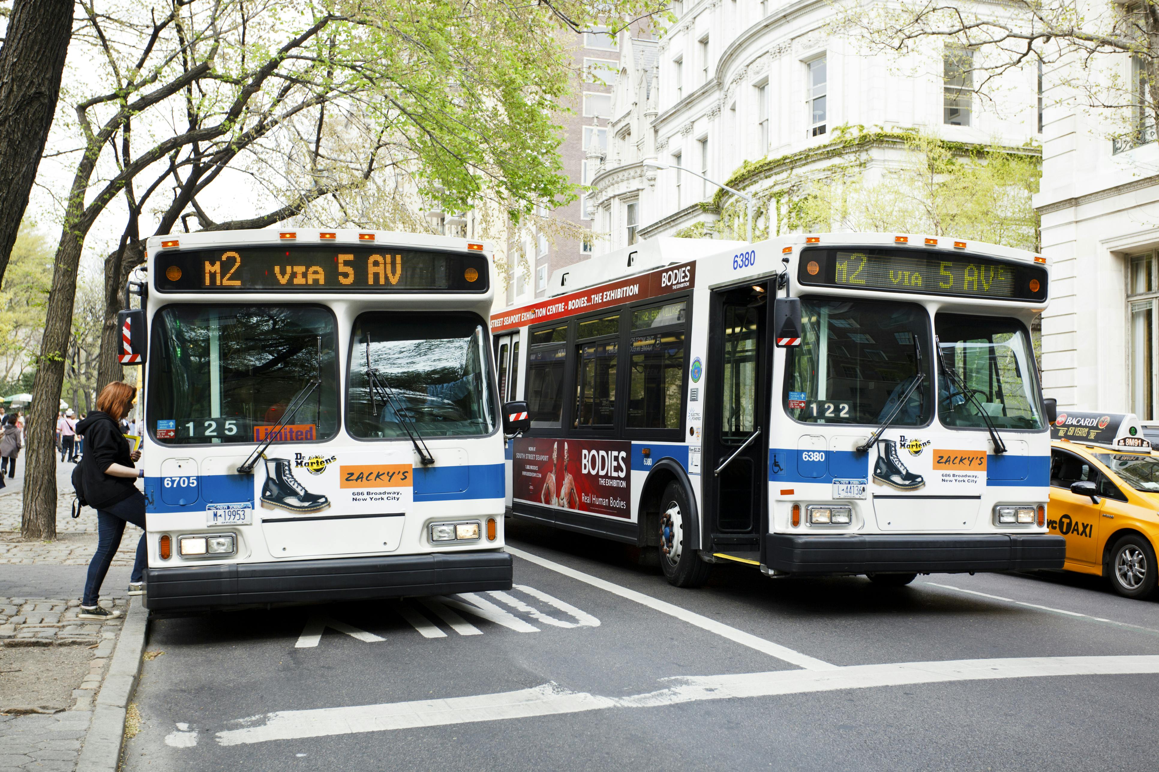 Woman getting on a New York City bus