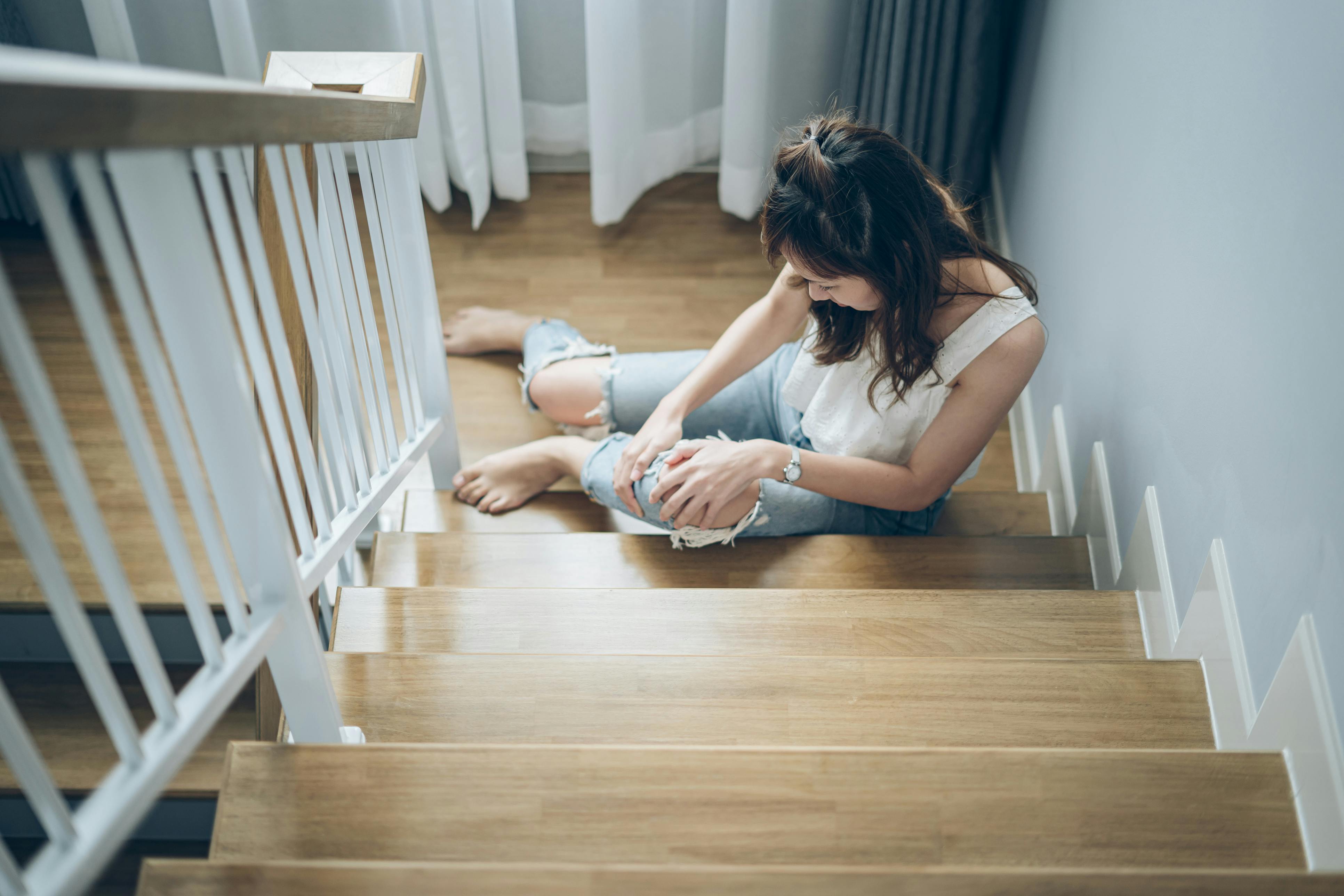 Woman who has fallen down stairs