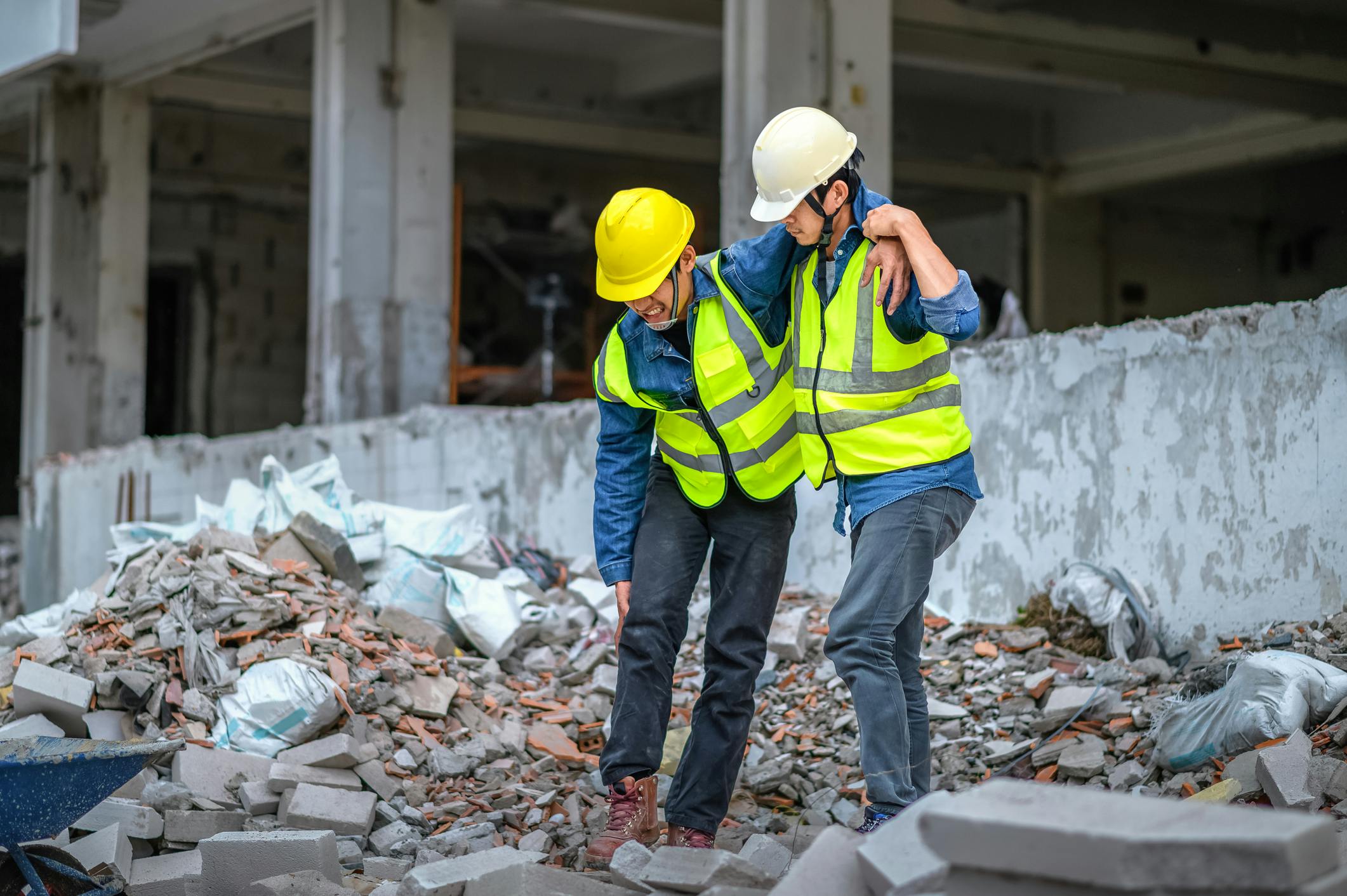 construction worker helping an injured worker