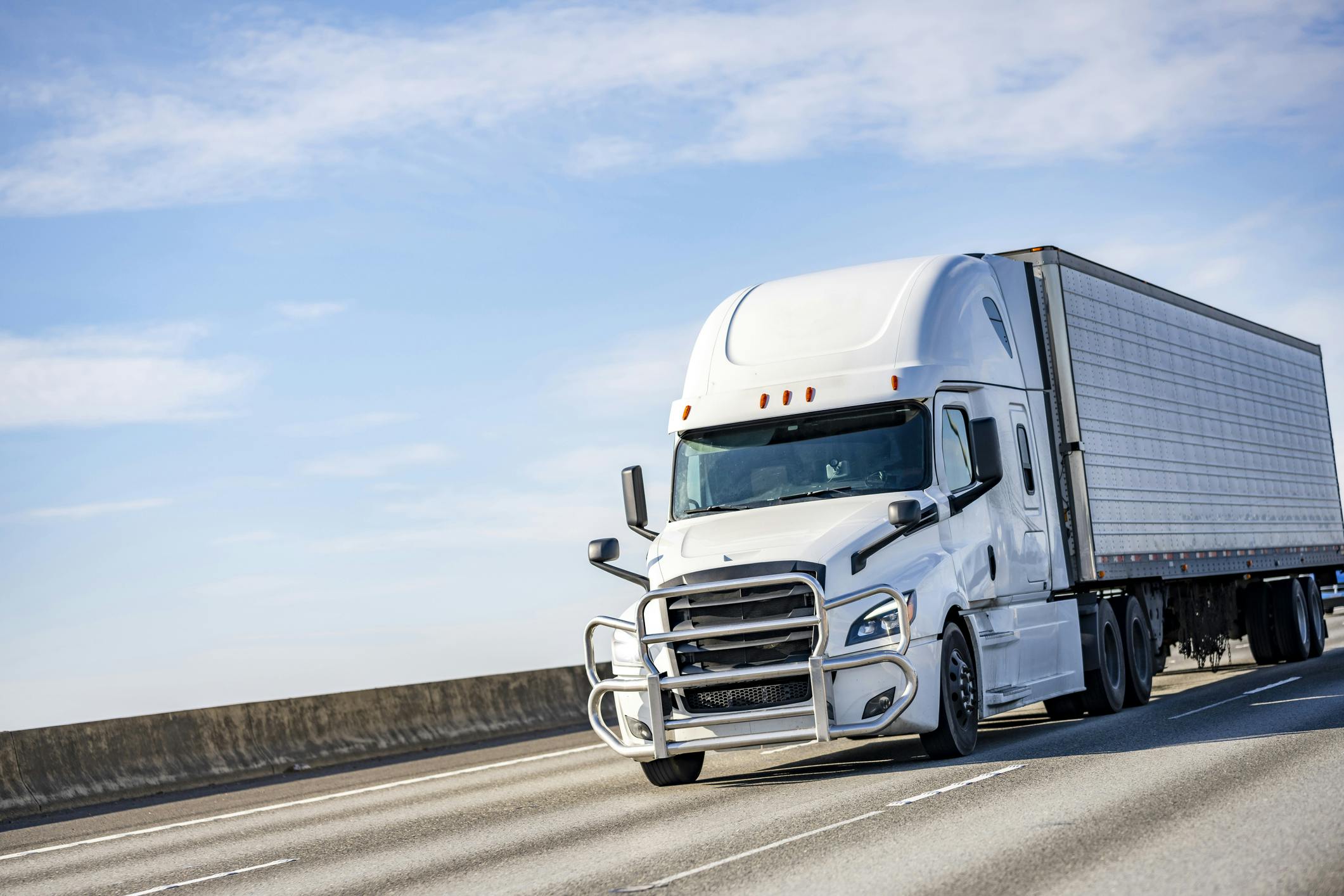 Commercial truck driving down a highway