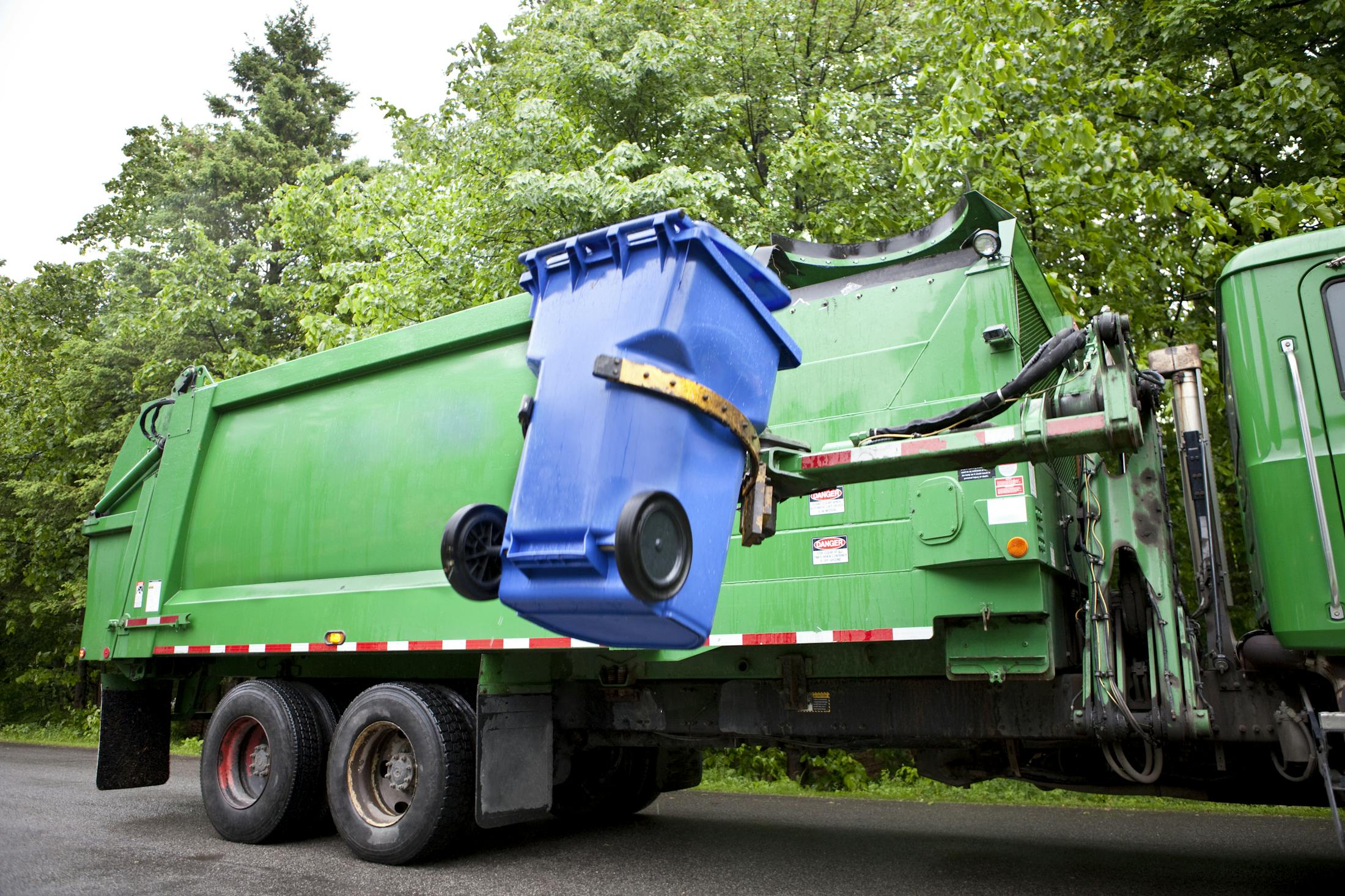garbage truck picking up trash
