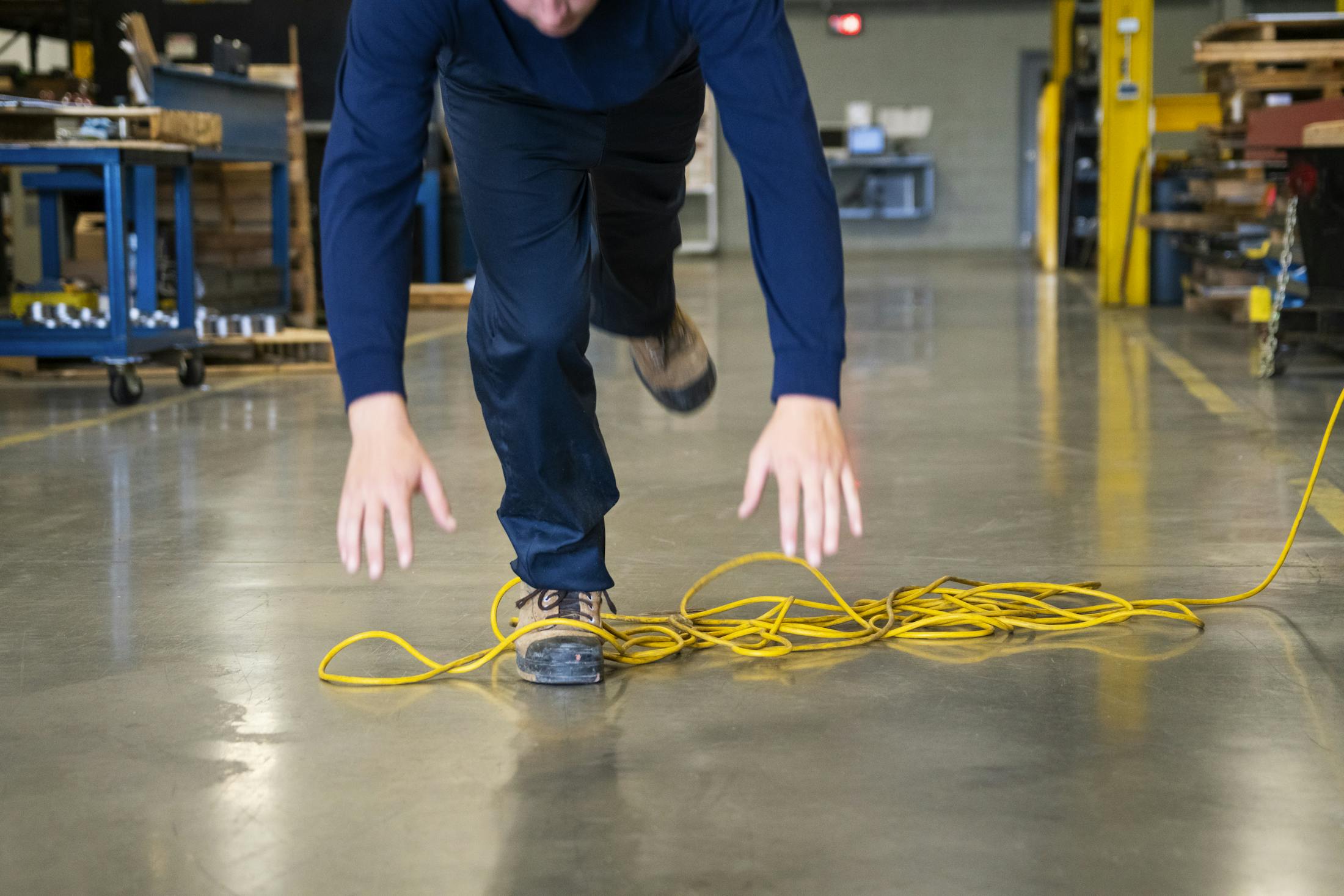 Man tripping over an electrical cord