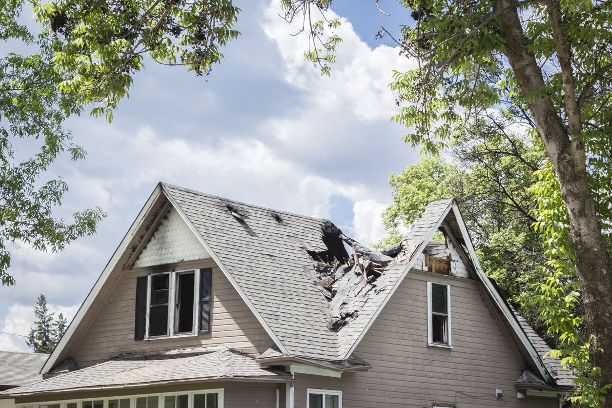 Roof on a house that has collapsed