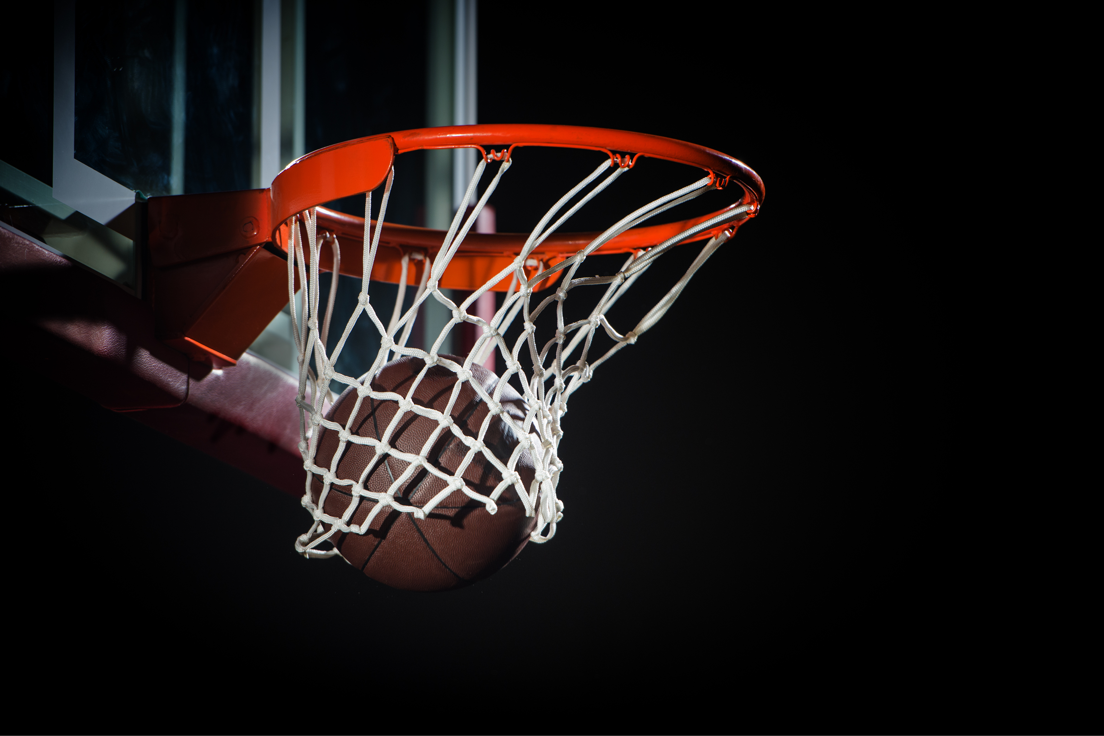 Basketball going through hoop