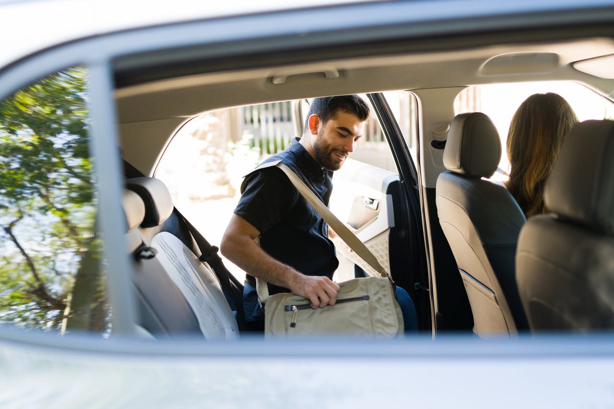man getting in to a car