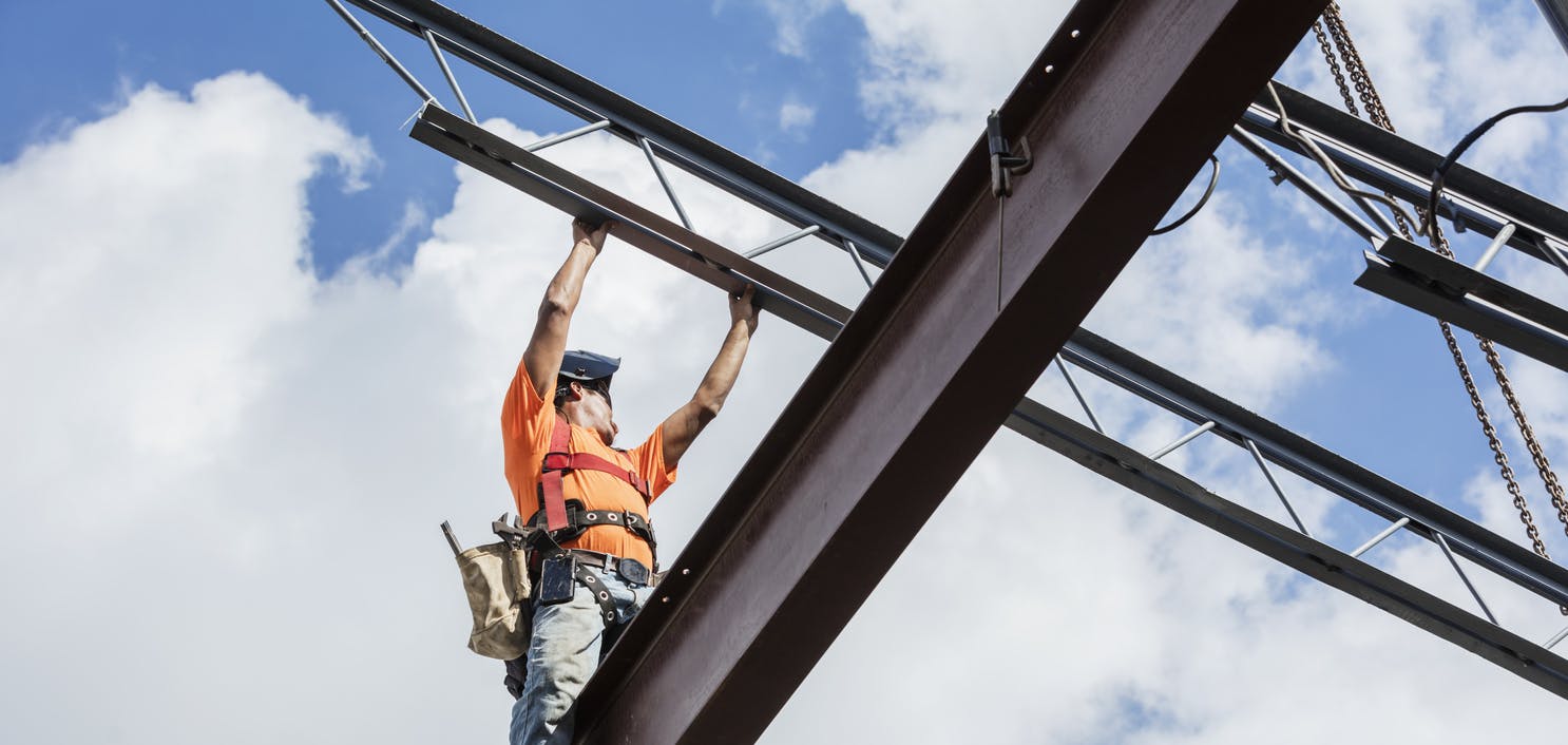 construction worker on beams