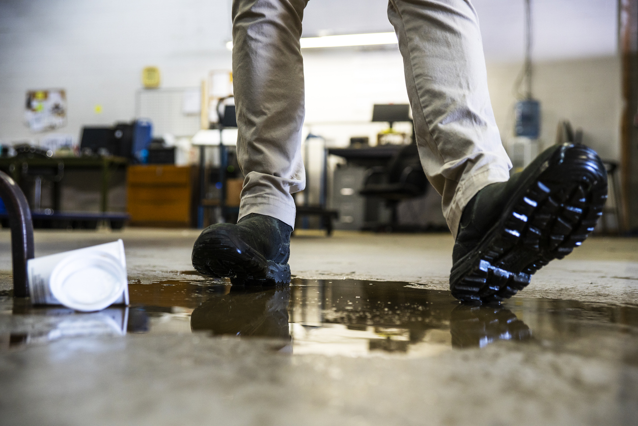 A person slipping on wet florr