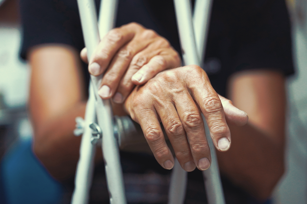 A man holding crutches
