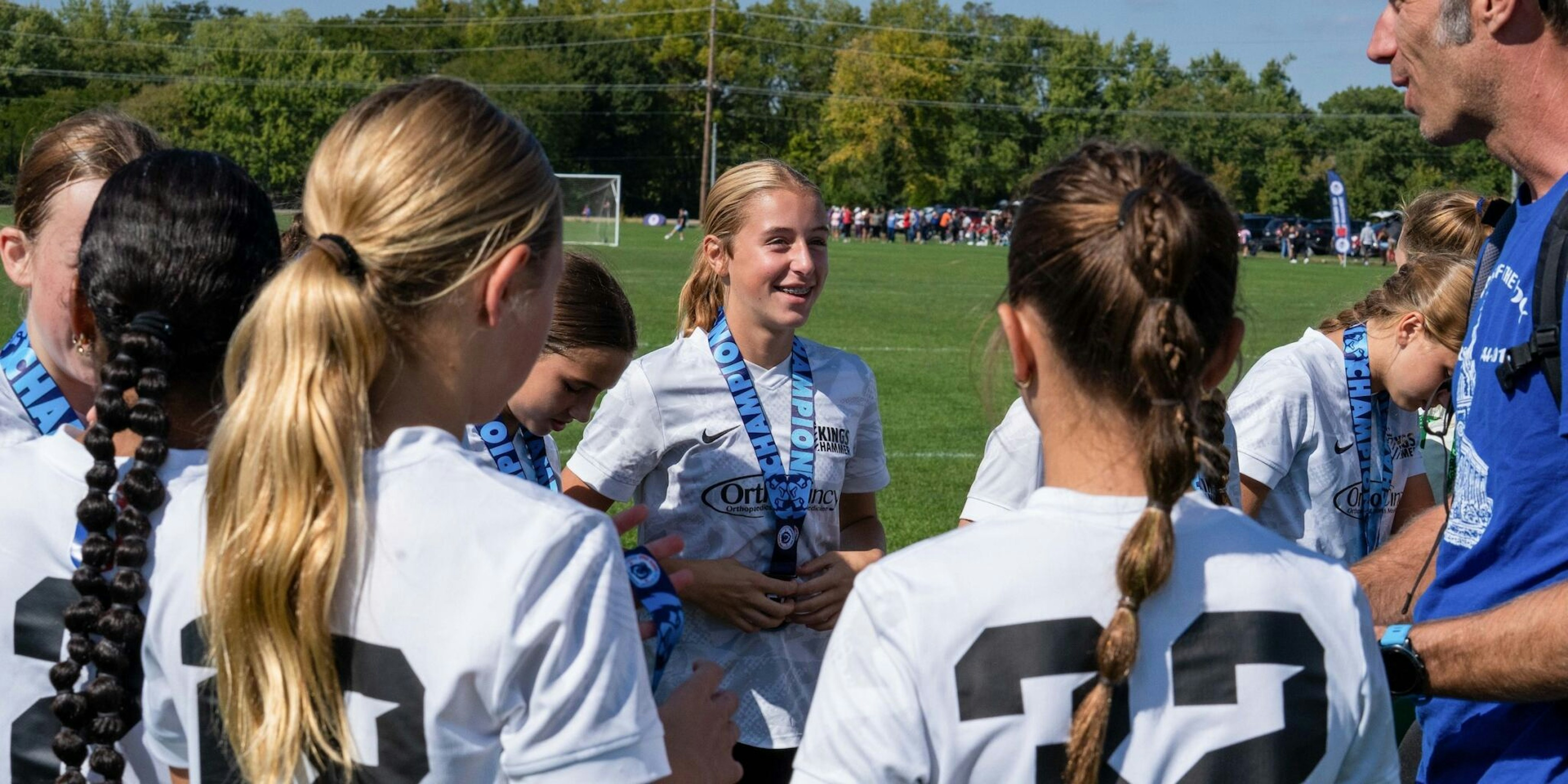 Girls laughing on soccer field