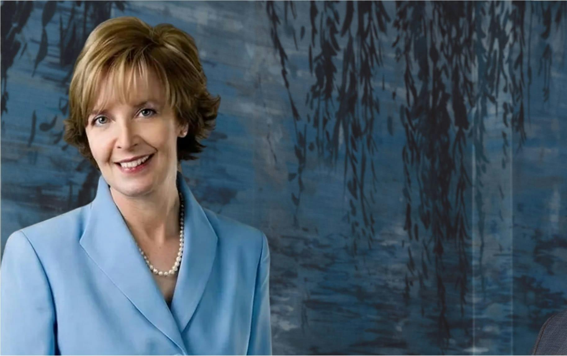 woman in light blue suit