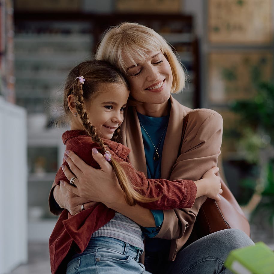 Woman holding young girl