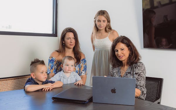 family sitting with attorney