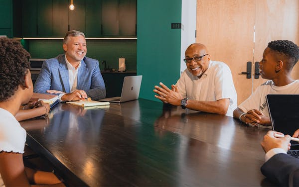 family sitting with attorney