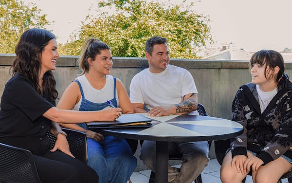 attorney doing paper work with clients