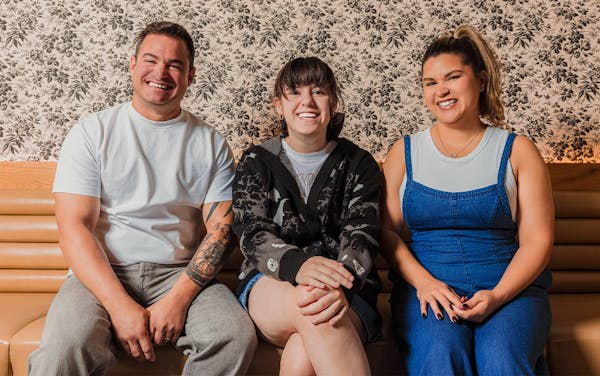 father and mother with daughter