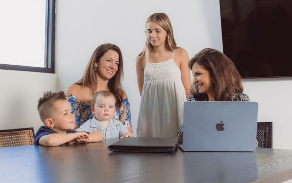 family sitting with attorney