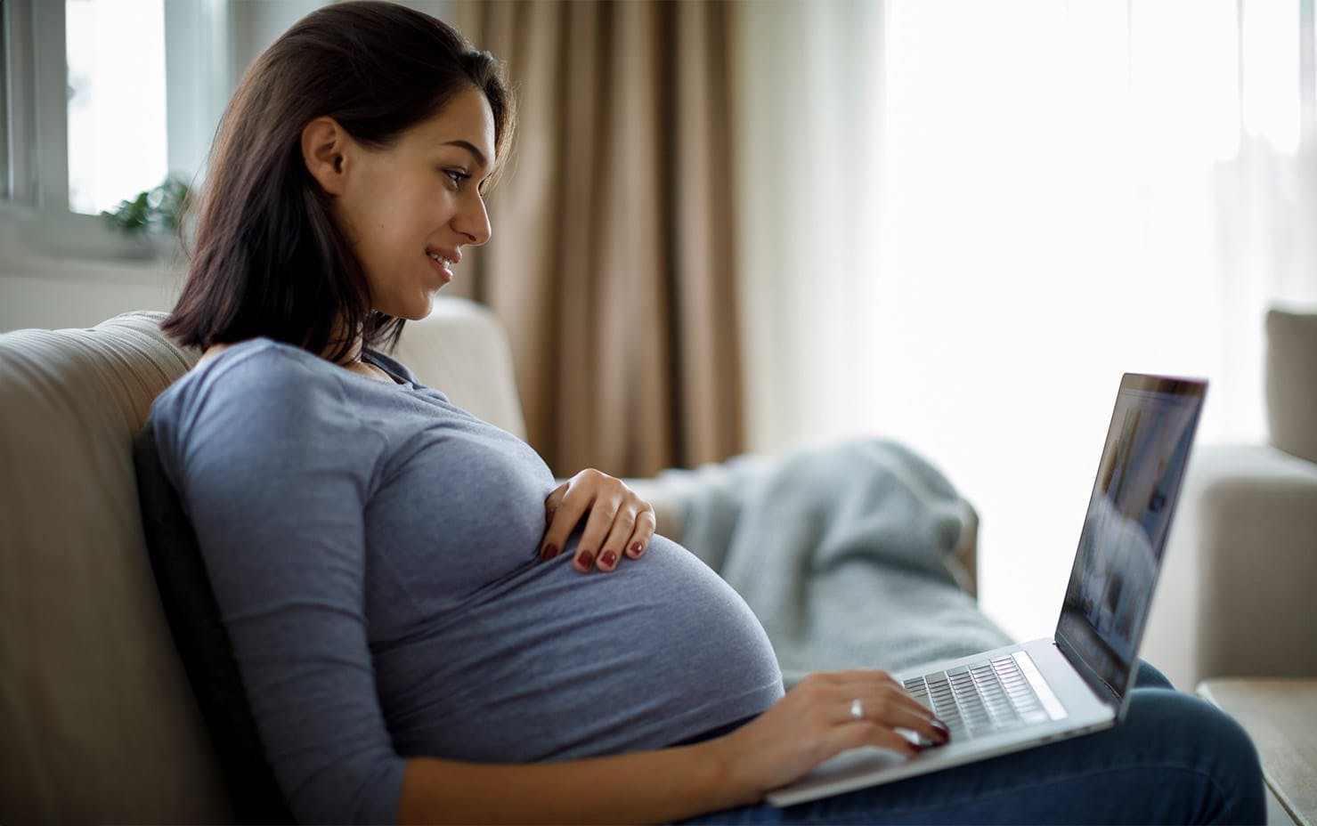 pregnant woman on laptop