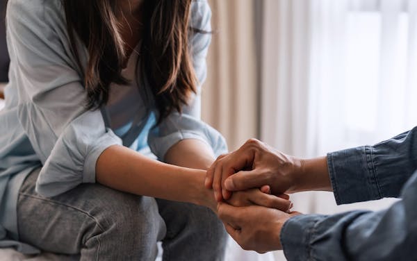 woman and man holding hands