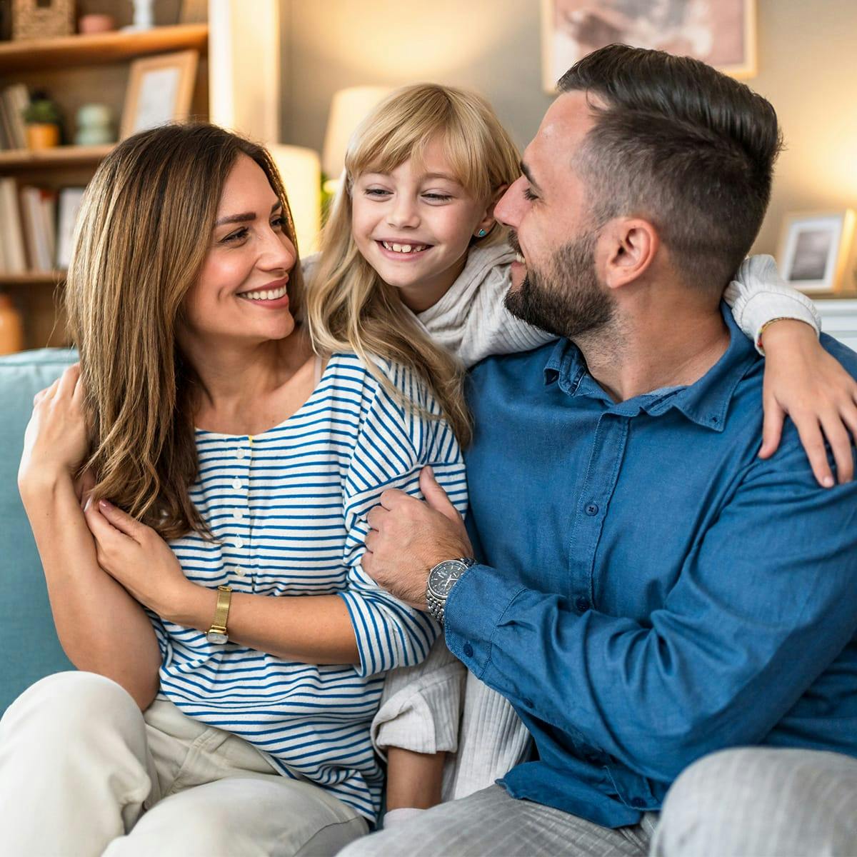 mother and father with blonde daughter