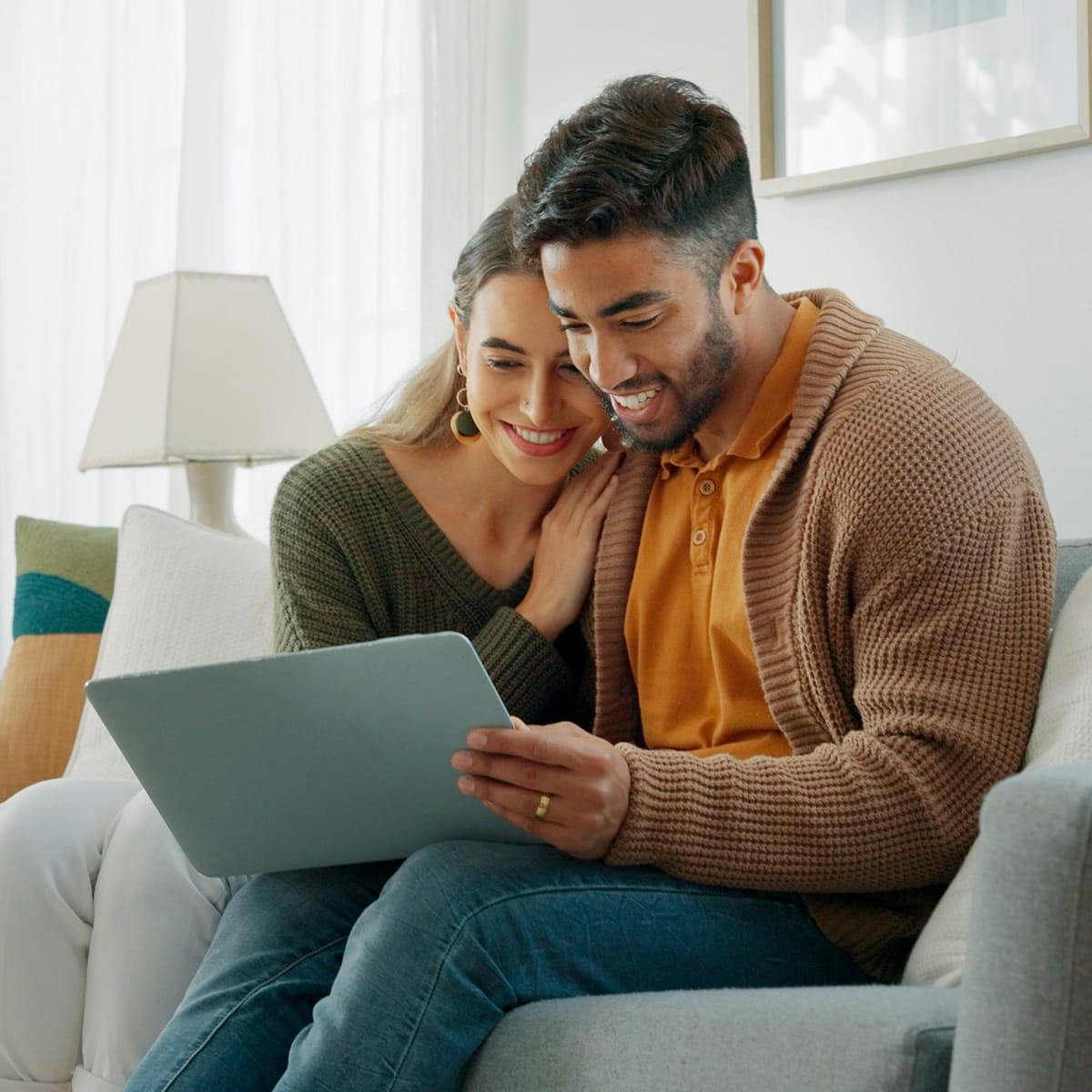 woman and man looking at laptop