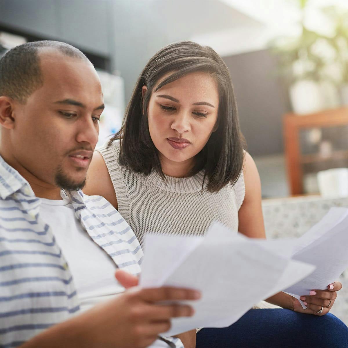 man and woman looking at paperwork