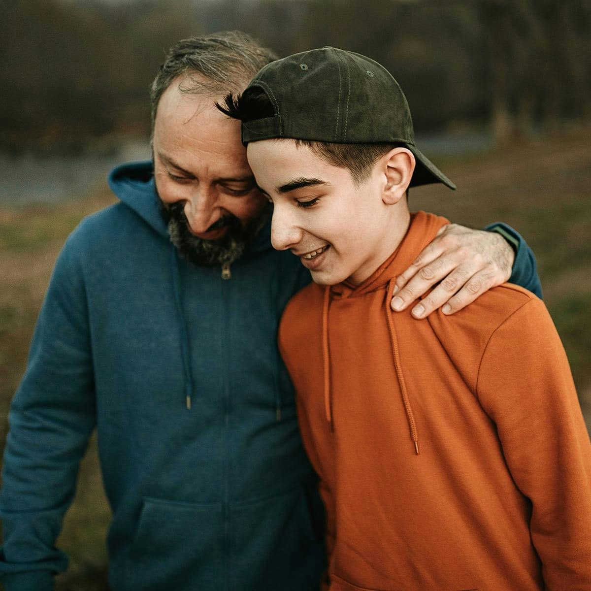 father and son smiling