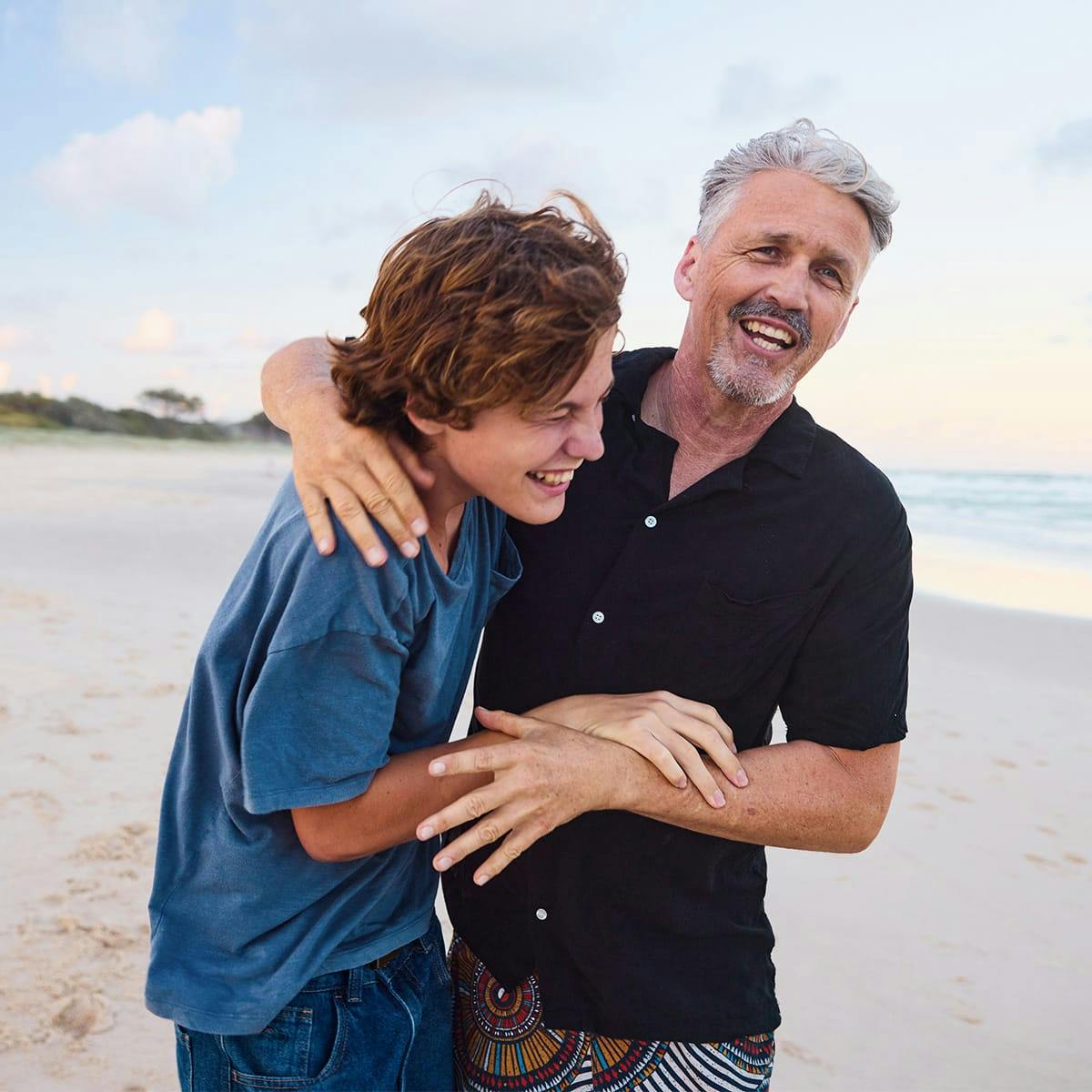 father and son smiling