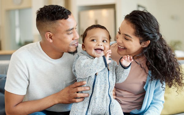mother and father with baby