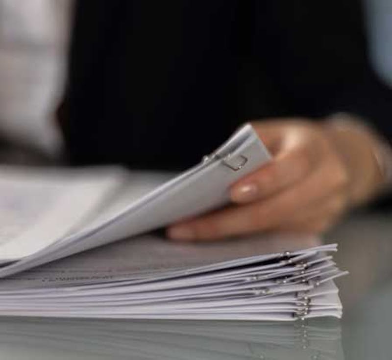 woman holding paperwork