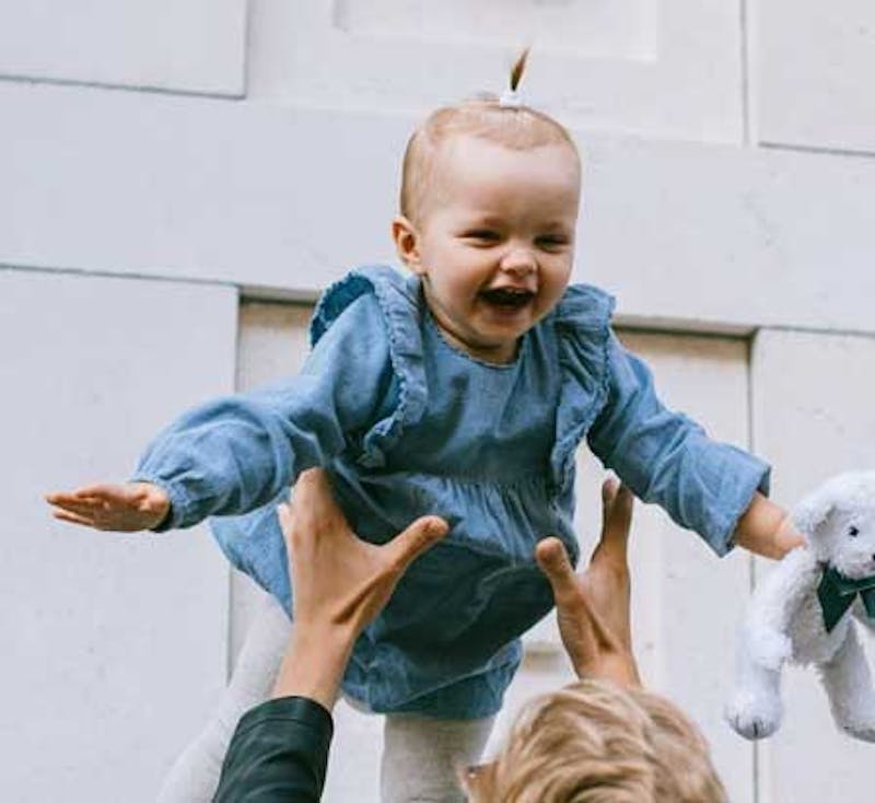 baby being thrown into air