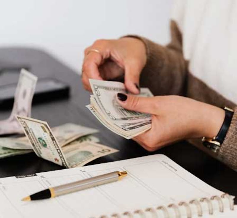 woman holding cash