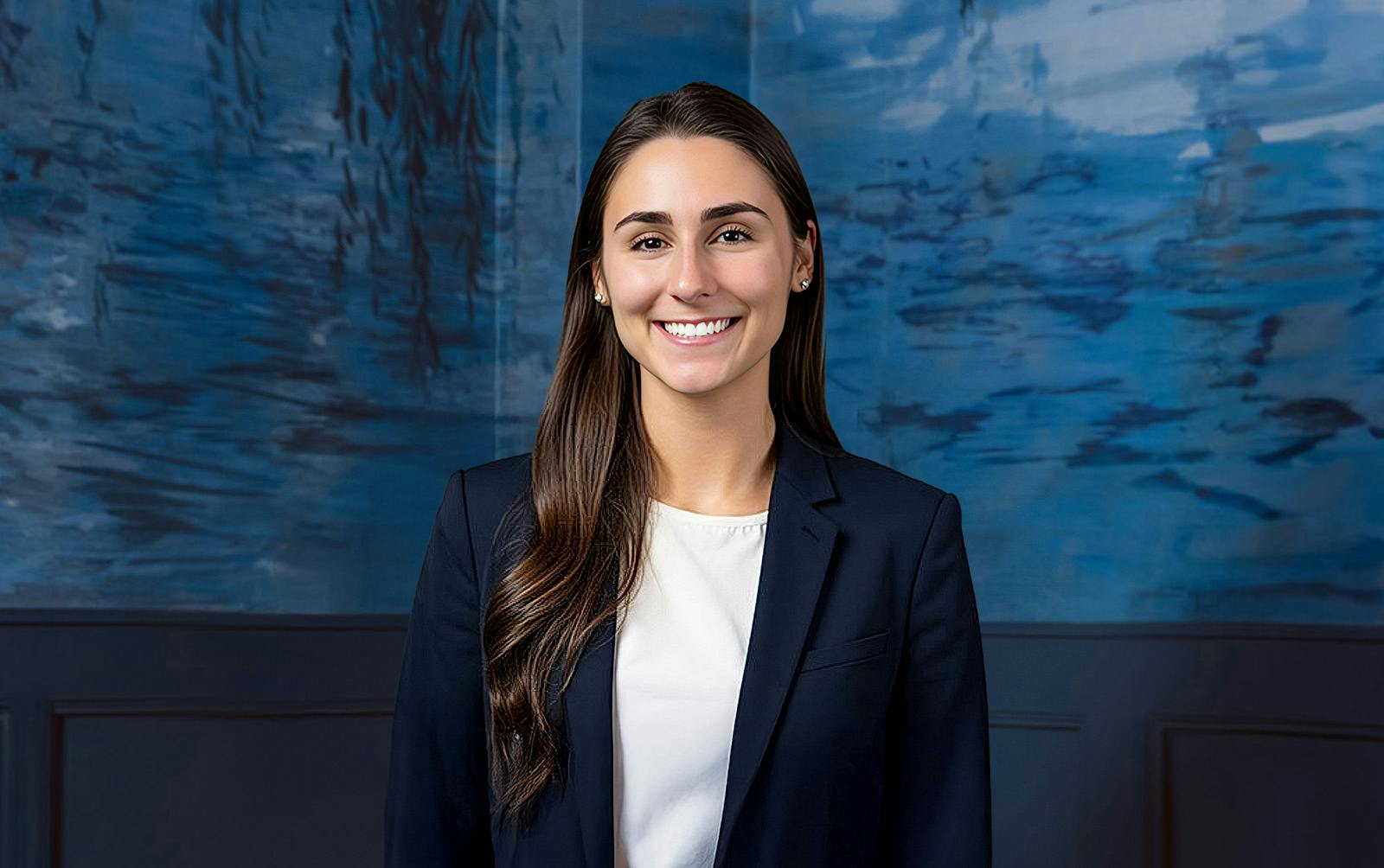 woman in dark blue suit smiling